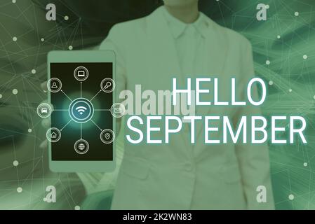 Schreiben mit Text Hallo September. Konzeptfoto, das eifrig eine herzliche Begrüßung für den Monat September-Lady-Press-Bildschirm des Mobiltelefons mit der futuristischen Technologie wünscht Stockfoto