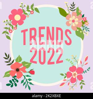 Textbeschriftung zur Darstellung von Trends 2022. Konzeptfoto Tendenz im kommenden Jahr breit diskutiert Online Frame dekoriert mit farbenfrohen Blumen und Blattwerk harmonisch angeordnet. Stockfoto