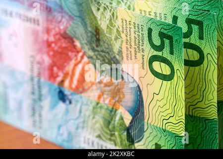 Schweizer Geld - Franken - ein geschäftlicher Hintergrund. Stockfoto