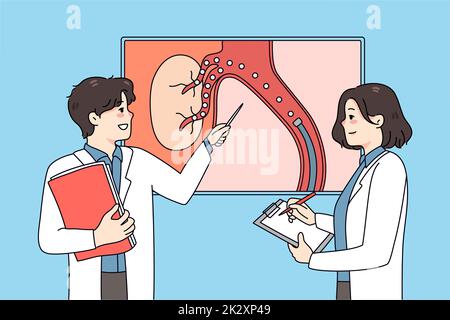 Arzt diskutiert Bild mit Embolisation Stockfoto