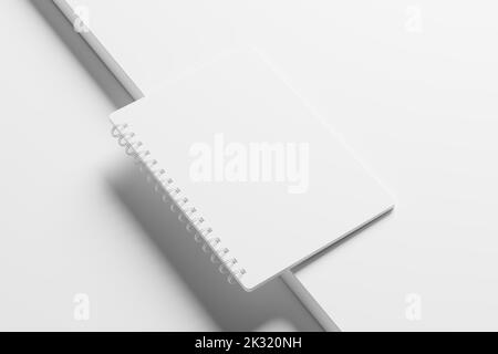 A4 A5 Notizbuch mit abgerundeten Ecken und Spiralen 3D Weißes, unbeschriftetes Mockup Stockfoto