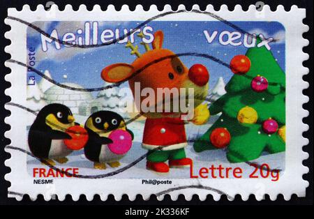 FRANKREICH - UM 2006: Eine in Frankreich gedruckte Marke zeigt Rentier, Weihnachtsbaum und zwei Pinguine, Weihnachtsgrüßen, um 2006 Stockfoto