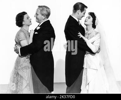 JOAN BENNETT SPENCER TRACY DON TAYLOR und ELIZABETH TAYLOR posierten Werbeportrait im VATER DER BRAUT 1950 Regisseur VINCENTE MINNELLI Roman Edward Streeter kostümiert Walter Plunkett (Männer) und Helen Rose (Frauen) Produzent Pandro S. Berman Metro Goldwyn Mayer Stockfoto