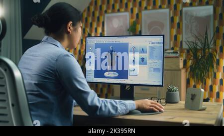 Weibliche 3D Designerin mit Remote-Arbeit an 3D Modellierung und Erstellung von 3D Visualisierung von Kleidung mit pc und professionelle Programm Stockfoto