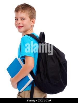 Ich studiere gerne hart. Studio-Aufnahme eines niedlichen jungen Grundschüler isoliert auf weiß. Stockfoto