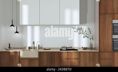 Japanische trendige Holzküche in Weiß- und Beigetönen. Holzschränke und Marmorplatte. Minimalistisches Innendesign Stockfoto