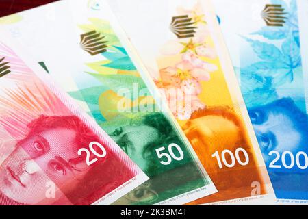 Israelisches Geld - New Shekel ein geschäftlicher Hintergrund Stockfoto