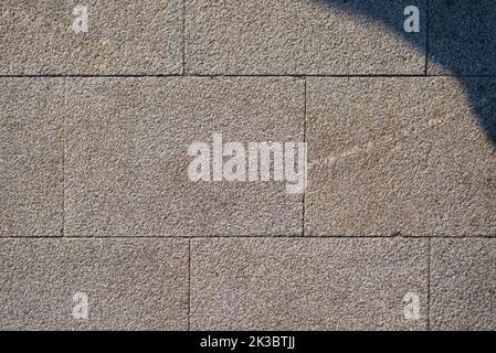 Struktur aus Granitziegeln Wand Stockfoto