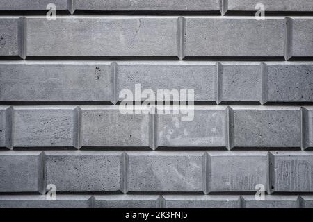 Graue, weiße Ziegel an der Wanddekoration als Hintergrund. Steinmauer Texturen. Hochwertige Fotos Stockfoto