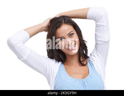 Angenehm überrascht. Studioaufnahme einer überraschten jungen Frau, isoliert auf Weiß. Stockfoto