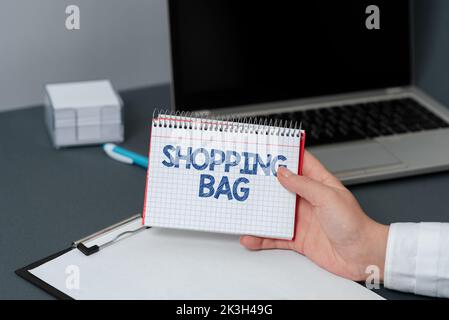 Textunterschrift mit Darstellung des Einkaufsbugs. Wort, das auf Containern zum Mitführen von persönlichen Besitztümern oder Einkäufen geschrieben wurde Stockfoto