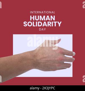 Zusammensetzung des internationalen Tages der menschlichen Solidarität Text und Hand Stockfoto