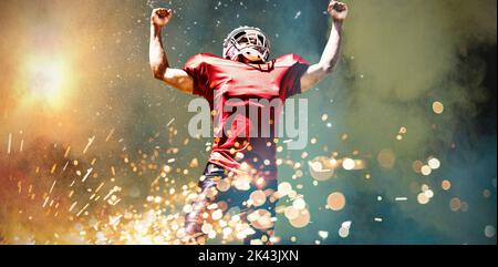 American Football Spieler gegen das Spritzen von Pulver Stockfoto
