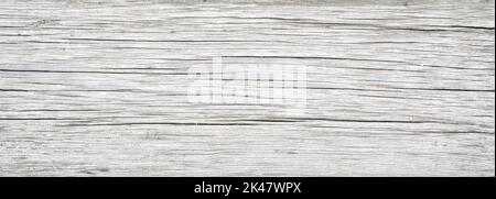Holzdiele Textur Hintergrund, alte weiße Holzbrett aus Scheune Nahaufnahme. Verwittertes, leichtes, raues Holz mit Rissen und Maserung, rustikales, trockenes Holz. Stockfoto