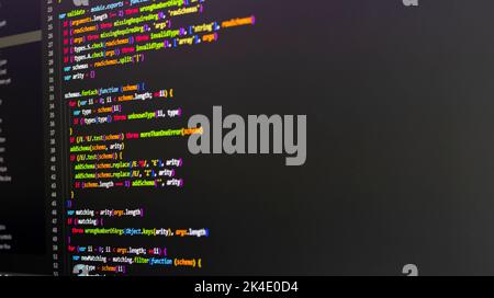 Komprimierter, farbiger Code-Hintergrund. Web-Programmierung mit Javascript-Codierung Stockfoto