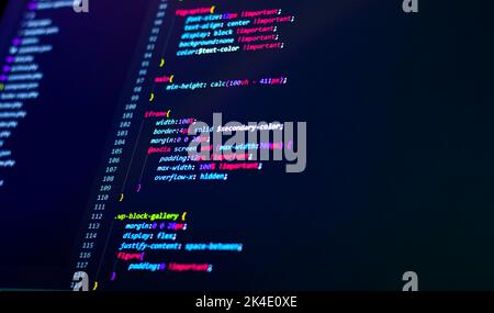 Komprimierter, farbiger Code-Hintergrund. Web-Programmierung mit Javascript-Codierung Stockfoto