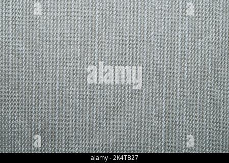 Beige gestrickter Hintergrund. Stoffstruktur. Textil Nahaufnahme Stockfoto