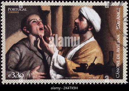 Canon of Medicine von Avicenna auf portugiesischer Briefmarke Stockfoto