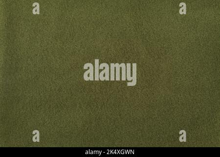 Khaki Fleece-Textur. Nahtloses Fleece-Stück. Die Textur des Stoffes ist grün. Stockfoto