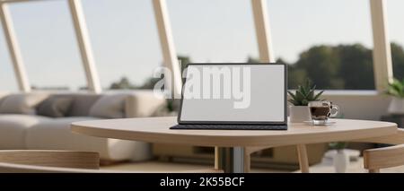 Tragbares Tablet mit weißem Bildschirm, Mockup und Kaffeetasse auf minimalem Holztisch in komfortablem und minimalem Café. Nahaufnahme. 3D Render, 3D illustrr Stockfoto