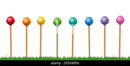 Glassende Gartenbälle, regenbogenfarbener Satz von Gartenkugeln auf Holzstäben, Dekorations-Skulpturen mit unterschiedlichen Mustern und Farben. Stockfoto