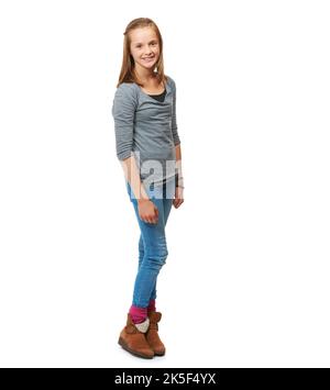 Wählen Sie Ihren eigenen Stil. Ganzjähriges Studioporträt eines fröhlichen Teenagers, das vor einem weißen Hintergrund steht. Stockfoto