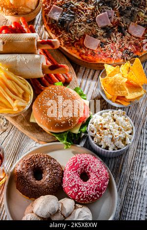 Lebensmittel, die das Krebsrisiko erhöhen. Junk Food Stockfoto