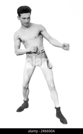 Ein Porträt von Charley White, geboren Charles Anchowitz am 25. März 1891 in Liverpool, England/ Er galt von 1906 bis 1923 als einer der besten Leichtgewicht-Boxer. Er boxte in den Vereinigten Staaten für seine gesamte Karriere und machte sein Zuhause in Chicago im Alter von sieben Jahren. Nach den aktuellen Regeln hätte er Kämpfe um Punkte für die Leichtbau-Weltmeisterschaft gewonnen, aber dann hätte er nur noch durch einen K.O.-Sieg den Titel gewinnen können. Er wurde in die Liste der 100 besten Schläger aller Zeiten des Ring Magazine aufgenommen, wahrscheinlich wegen seiner bekannten Fähigkeiten mit dem linken Haken. Stockfoto