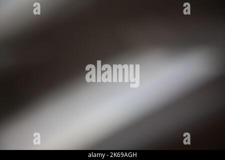 Unschärfe glühen Hintergrund Licht Leck braun weißen Strahlen Stockfoto