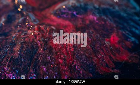 Strukturierter Glitzer Hintergrund glitzernde rote blaue Tinten Stockfoto