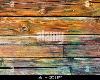 Ein Holzzaun alten Nahaufnahme Holzboden Hütte Scheune Ranch vintage wilden Westtür hängenden Ställe Bord Bauernhof Prärie Pionier Planke Holz Stockfoto