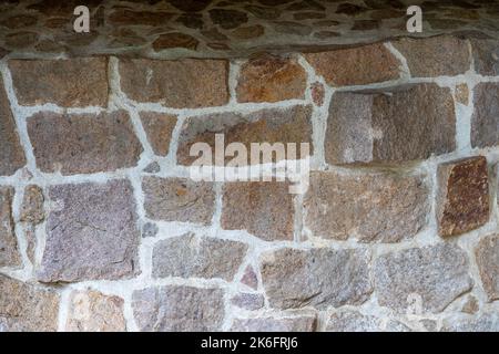 Natursteinmauer Hintergrundtextur Stockfoto