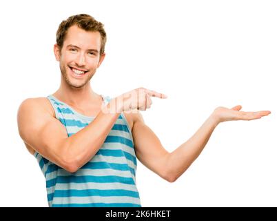 Immer auf der hellen Seite. Ein junger Mann, der vor einem Studiohintergrund gestikuliert. Stockfoto
