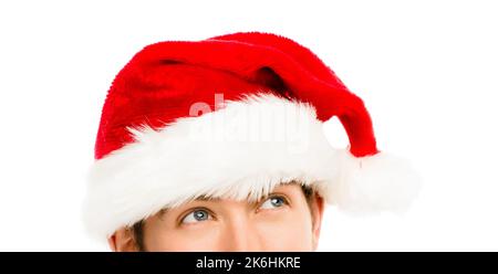 Weihnachten ist nicht nur ein Fest. Ein junger Geschäftsmann, der einen weihnachtshut vor einem Studiohintergrund trägt. Stockfoto