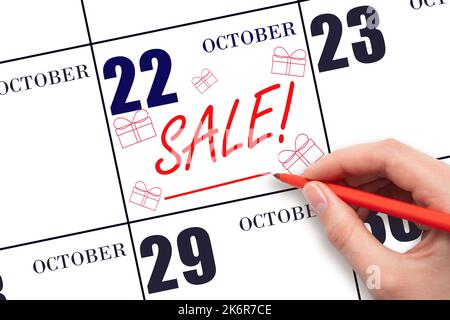 22. Tag im Oktober. Handgeschriebene Text VERKAUF und Zeichnung Geschenk-Boxen am Kalenderdatum Oktober 22. Erinnerung Zum Einkauf. Online-Shopping. Herbst Monat, Tag Stockfoto