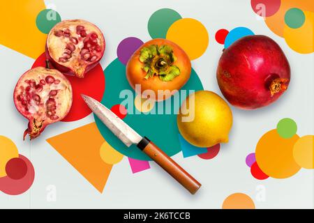Granatapfel, Kakimmon und Zitronenfrüchte auf einem farbenfrohen, fröhlichen und lustigen Hintergrund. Stockfoto