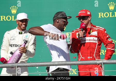 Lewis Hamilton (GB), Mercedes F1 Team. Usain Bolt (STAU) Sprinter. Kimi Räikkönen (FIN) Scuderia Ferrari. Circuit of the Americas Podium. Stockfoto