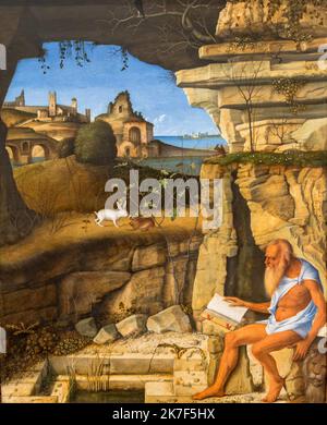 ©Active Museu/MAXPPP - ActiveMuseum 0000973.jpg / La Lecture de Saint Jerome, 1505 - Giovanni Bellini - Saint Jerome Reading 1505 - / Giovanni Bellini / Peinture Active Museum / Le Pictorium Bad, Brücke, katholische Religion, Höhle, Einsiedler, Hügel, Löwe, Kaninchen, Lesen, Renaissance, Ruine, Heiliger, Meer, Strauch, Vegetation, Vertikal, Wasser, Heiliger Hieronymus, 16. Jahrhundert, Giovanni Bellini, Malerei, Stockfoto