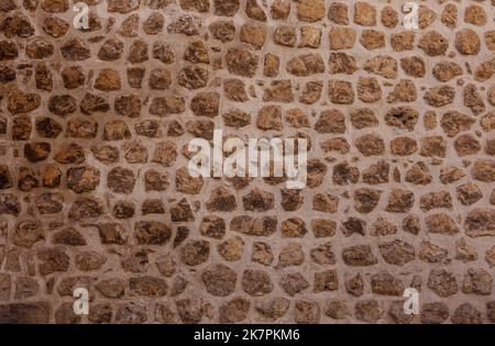 Eine alte Steinmauer Hintergrund. Stockfoto