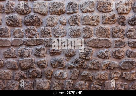 Nahaufnahme der Steinmauer. Graue Steinwand Hintergrund. Stockfoto