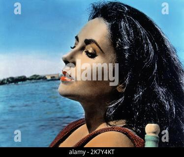 Elizabeth Taylor Film: The Sandpiper (USA 1965) Charaktere: Laura Reynolds Regie: Vincente Minnelli 23 June 1965 **WARNUNG** Dieses Foto ist nur für den redaktionellen Gebrauch bestimmt und unterliegt dem Copyright von MGM und/oder dem Fotografen, der von der Film- oder Produktionsfirma beauftragt wurde, und kann nur durch Publikationen im Zusammenhang mit der Bewerbung des oben genannten Films reproduziert werden. Eine obligatorische Gutschrift an MGM ist erforderlich. Der Fotograf sollte auch bei Bekanntwerden des Fotos gutgeschrieben werden. Ohne schriftliche Genehmigung der Film Company kann keine kommerzielle Nutzung gewährt werden. Stockfoto