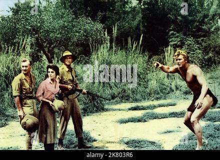 Robert Douglas, Joanna Barnes, Cesare Danova & Denny Miller Film: Tarzan, The Ape man (USA 1959) Charaktere: James Parker,Jane Parker,Harry holt & Tarzan Regie: Joseph M. Newman 01 October 1959 **WARNUNG** Dieses Foto ist nur für redaktionelle Verwendung bestimmt und unterliegt dem Copyright von MGM und/oder dem von der Film- oder Produktionsfirma beauftragten Fotografen und kann nur durch Publikationen im Zusammenhang mit der Bewerbung des oben genannten Films reproduziert werden. Eine obligatorische Gutschrift an MGM ist erforderlich. Der Fotograf sollte auch bei Bekanntwerden des Fotos gutgeschrieben werden. Eine kommerzielle Nutzung kann ohne schriftliche Genehmigung von nicht gewährt werden Stockfoto