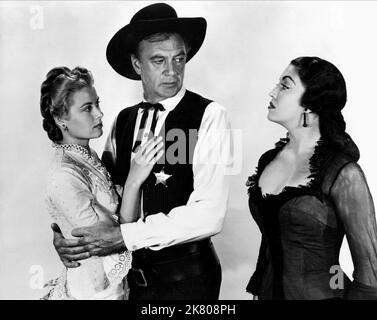 Grace Kelly, Gary Cooper, Katy Jurado Film: High Noon (USA 1952) Charaktere: Amy Fowler Kane,Marshal will Kane,Helen Ramirez Regie: Fred Zinnemann 07 July 1952 **WARNUNG** Dieses Foto ist nur für den redaktionellen Gebrauch bestimmt und unterliegt dem Copyright von UNITED ARTISTS und/oder dem Fotografen, der von der Film- oder Produktionsfirma beauftragt wurde und darf nur durch Publikationen im Zusammenhang mit der Bewerbung des oben genannten Films reproduziert werden. Eine obligatorische Gutschrift für UNITED ARTISTS ist erforderlich. Der Fotograf sollte auch bei Bekanntwerden des Fotos gutgeschrieben werden. Ohne schriftliche Genehmigung der Film Co. Kann keine kommerzielle Nutzung gewährt werden Stockfoto