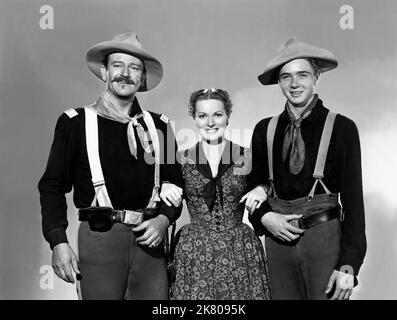 John Wayne, Maureen O'Hara & Harry Carey Jr. Film: Rio Grande (USA 1950) Charaktere: LT. Col. Kirby Yorke, & Regie: John Ford 15 November 1950 **WARNUNG** Dieses Foto ist nur für redaktionelle Zwecke bestimmt und unterliegt dem Copyright von REPUBLIC PICTURES und/oder des Fotografen, der von der Film- oder Produktionsfirma beauftragt wurde und darf nur von Publikationen im Zusammenhang mit der Bewerbung des oben genannten Films reproduziert werden. Eine obligatorische Gutschrift für REPUBLIKANISCHE BILDER ist erforderlich. Der Fotograf sollte auch bei Bekanntwerden des Fotos gutgeschrieben werden. Ohne schriftliche Genehmigung der Film Company kann keine kommerzielle Nutzung gewährt werden. Stockfoto