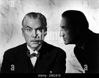 Nigel Bruce & Basil Rathbone Film: The Woman in Green; Sherlock Holmes: The Woman in Green (USA 1945) Charaktere: Dr. John H. Watson, Sherlock Holmes / Sherlock Holmes Verfilmung Regie: Roy William Neill 15 June 1945 **WARNUNG** Dieses Foto ist nur für den redaktionellen Gebrauch bestimmt und unterliegt dem Copyright von UNIVERSAL-BILDERN und/oder dem Fotografen, der von der Film- oder Produktionsfirma beauftragt wurde und darf nur von Publikationen im Zusammenhang mit der Bewerbung des oben genannten Films reproduziert werden. Eine obligatorische Gutschrift für UNIVERSELLE BILDER ist erforderlich. Der Fotograf sollte auch bei Bekanntwerden des Fotos gutgeschrieben werden. Keine Kommunikation Stockfoto