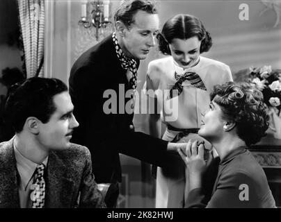 Leslie Howard & Bette Davis Film: IT'S Love I'M After (1936) Regie: Archie Mayo 08 October 1937 **WARNUNG** Dieses Foto ist nur für den redaktionellen Gebrauch bestimmt und unterliegt dem Copyright von WARNER BROS und/oder des Fotografen, der von der Film- oder Produktionsfirma beauftragt wurde, und kann nur von Publikationen im Zusammenhang mit der Bewerbung des oben genannten Films reproduziert werden. Eine obligatorische Gutschrift an WARNER BROS ist erforderlich. Der Fotograf sollte auch bei Bekanntwerden des Fotos gutgeschrieben werden. Ohne schriftliche Genehmigung der Film Company kann keine kommerzielle Nutzung gewährt werden. Stockfoto