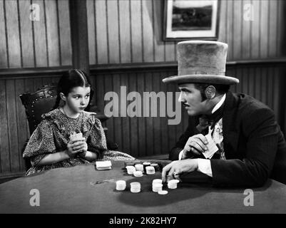 Virginia Weidler & Preston Foster Film: Die Ausgestoßenen Von Poker Flat (1937) Charaktere: Luck, John Oakhurst Regie: Christy Cabanne 16. April 1937 **WARNUNG** Dieses Foto ist nur für redaktionelle Zwecke bestimmt und unterliegt dem Copyright von RKO und/oder des Fotografen, der von der Film- oder Produktionsfirma beauftragt wurde, und kann nur von Publikationen im Zusammenhang mit der Bewerbung des oben genannten Films reproduziert werden. Eine obligatorische Gutschrift an RKO ist erforderlich. Der Fotograf sollte auch bei Bekanntwerden des Fotos gutgeschrieben werden. Ohne schriftliche Genehmigung der Film Company kann keine kommerzielle Nutzung gewährt werden. Stockfoto