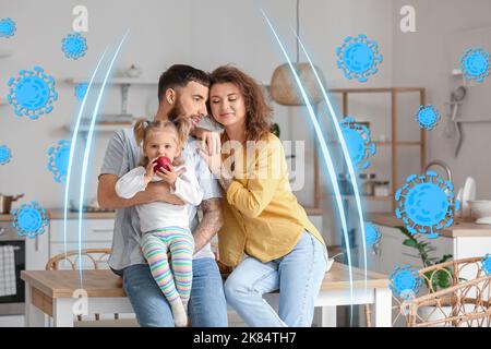 Glückliche junge Familie in der Küche. Konzept der starken Immunität Stockfoto