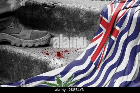 Das Bein des Militärs steht auf der Stufe neben der Flagge des Britischen Territoriums im Indischen Ozean, dem Konzept des militärischen Konflikts Stockfoto