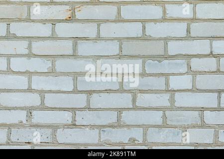 Weiße Ziegelwand aus gebrauchten Material. Hintergrundbild mit abstrakter Textur Stockfoto